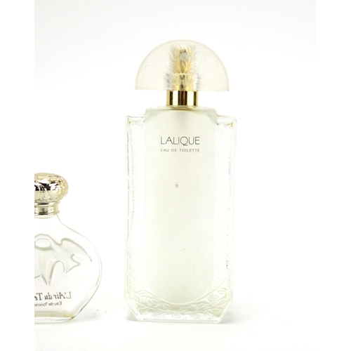 2277A - Two Lalique frosted and clear glass perfume bottles and a Worth example
