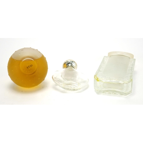2277A - Two Lalique frosted and clear glass perfume bottles and a Worth example