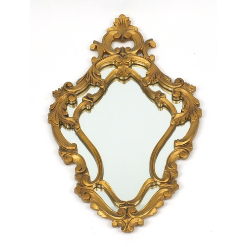 59 - Gilt framed cartouche shaped mirror, 70cm high