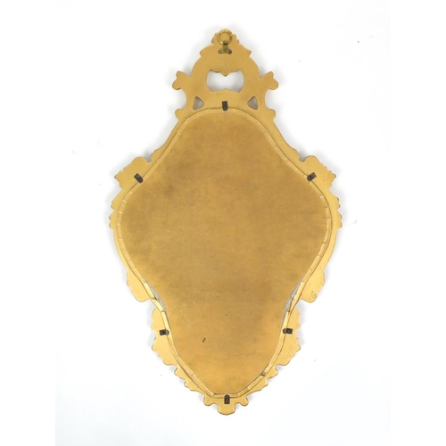 59 - Gilt framed cartouche shaped mirror, 70cm high