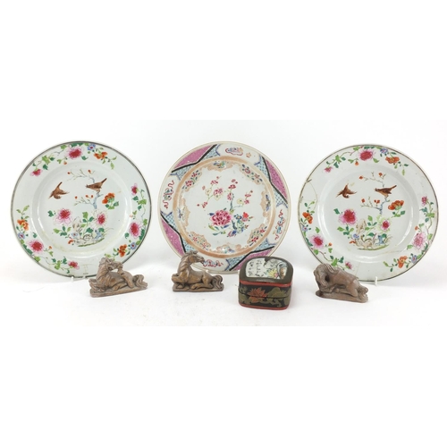 457 - Three Oriental porcelain plates, a lacquered box and cover and three carved stone horses