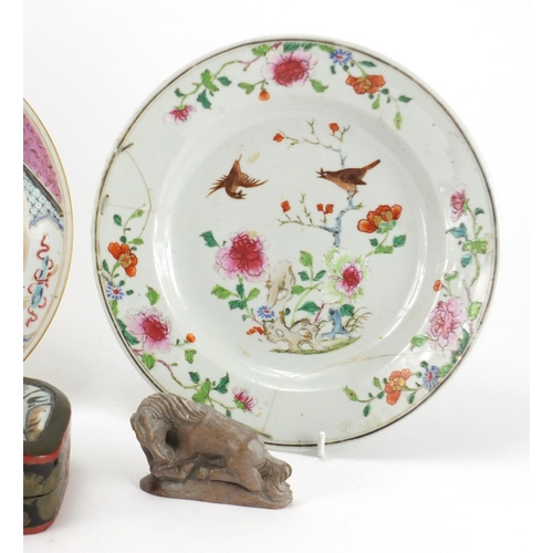 457 - Three Oriental porcelain plates, a lacquered box and cover and three carved stone horses