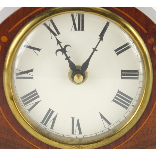 163 - Inlaid mahogany mantel clock with brass feet, 13cm high