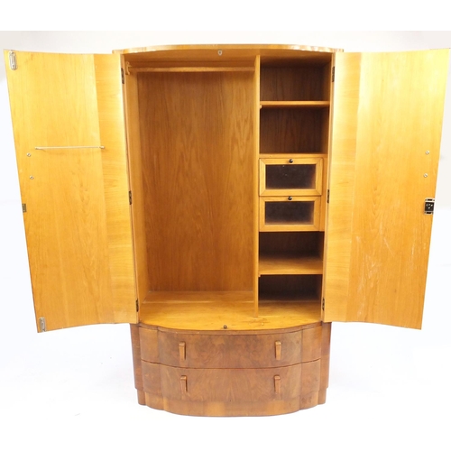 35 - Art Deco Gentleman's walnut two door tallboy, fitted with two drawers to the base, 181cm H x 105cm W... 