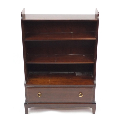 69 - Stagg waterfall bookcase, fitted with a drawer to the base, 112cm H x 76cm W x 31cm D