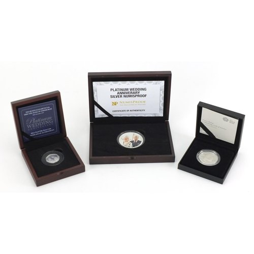 2336 - Three commemorative silver proof coins with fitted cases, Numisproof two platinum wedding Anniversar... 