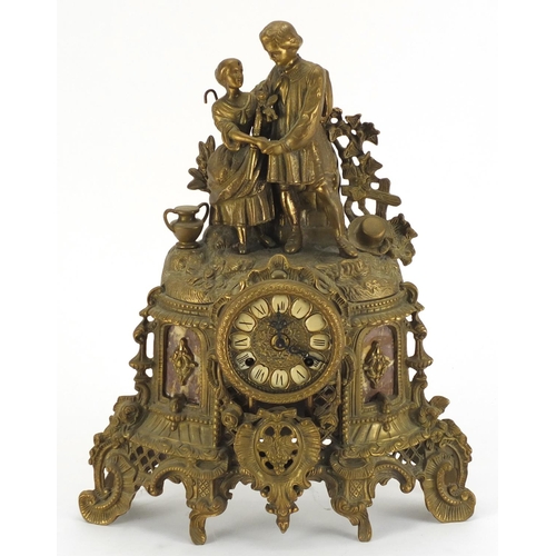 2203 - Classical gilt metal and marble mantel clock, surmounted with two lovers, the dial with Roman numera... 