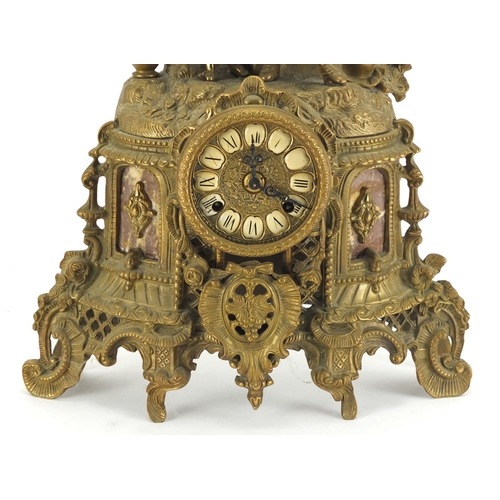 2203 - Classical gilt metal and marble mantel clock, surmounted with two lovers, the dial with Roman numera... 