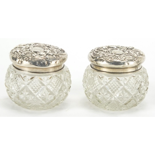 2387 - Pair of cut glass bud vases and jars with covers, both with silver mounts, the largest 12.5cm high