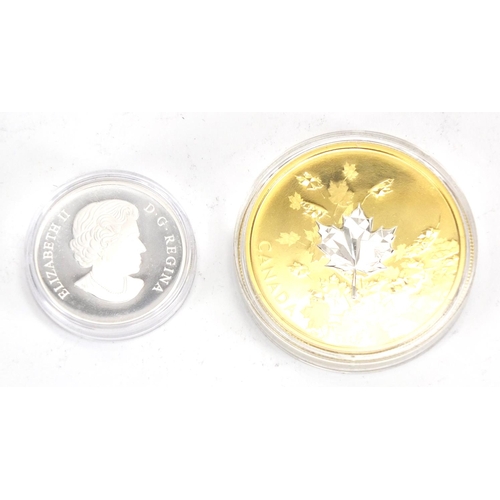2327 - Two Canadian silver proof coins, 2017 fifty dollar silver whispering maple leaf and 2017 platinum we... 