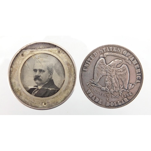 618 - Novelty 19th century trade dollar secret coin locket, 4cm in diameter, approximate weight 21.8g