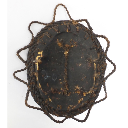 452 - Papua new Guinea Sepik River turtle shell mask, hand painted and inset with cowrie shells, 32cm x 27... 