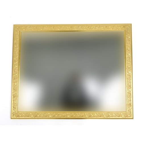29 - Large gilt framed wall hanging mirror, with bevelled glass, 117cm x 91cm