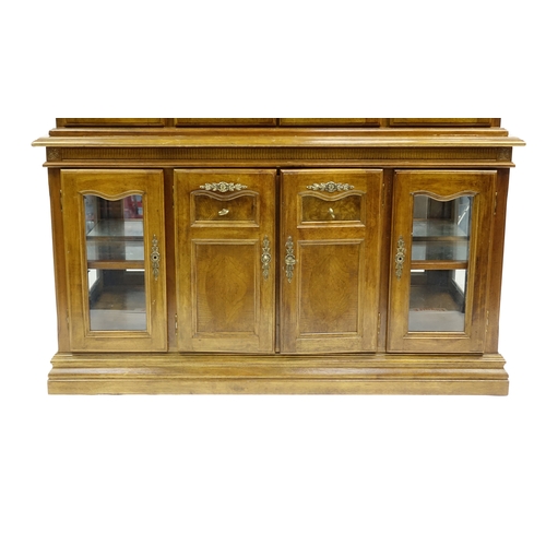 27 - American walnut dresser, fitted with a pair of glazed doors above a pair of cupboard doors and glaze... 