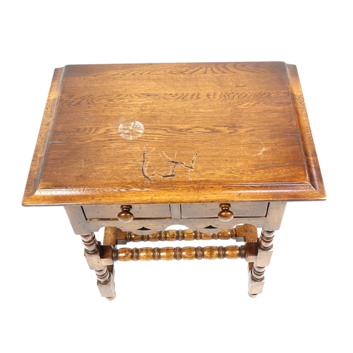 50 - Carved oak side table fitted with two drawers, 72cm H x 69cm W x 45cm D
