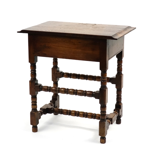 50 - Carved oak side table fitted with two drawers, 72cm H x 69cm W x 45cm D