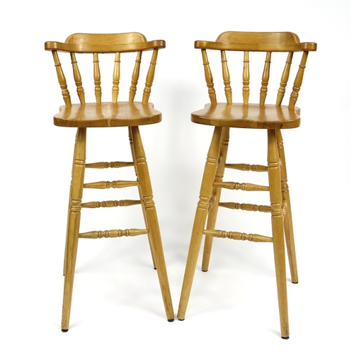 65 - Pair of light oak breakfast stools, 104cm high