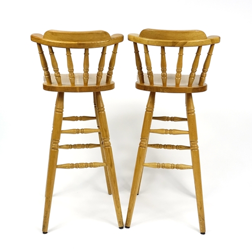 65 - Pair of light oak breakfast stools, 104cm high