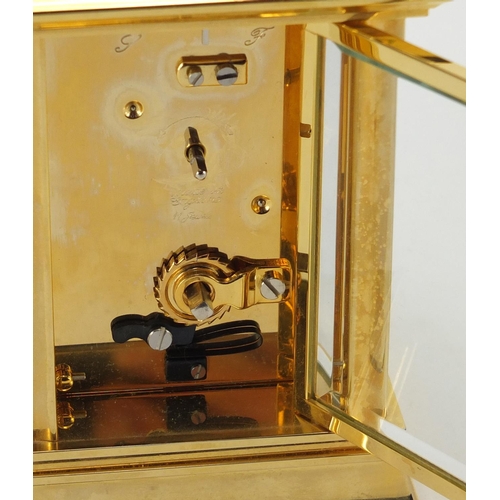 2145 - Halcyon Days enamel brass cased carriage clock, with Roman numerals and fitted box, 12cm high