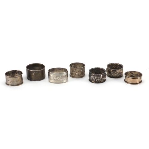 2415 - Seven silver napkin rings some with embossed and chased decoration, various hallmarks, approximate w... 