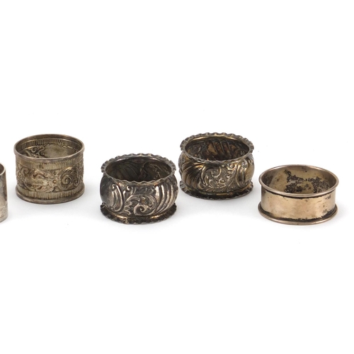 2415 - Seven silver napkin rings some with embossed and chased decoration, various hallmarks, approximate w... 