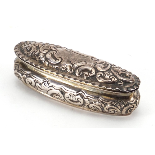 2406 - Victorian oval silver box, with embossed decoration and hinged lid, indistinct markers mark Birmingh... 