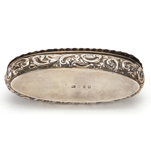 2406 - Victorian oval silver box, with embossed decoration and hinged lid, indistinct markers mark Birmingh... 
