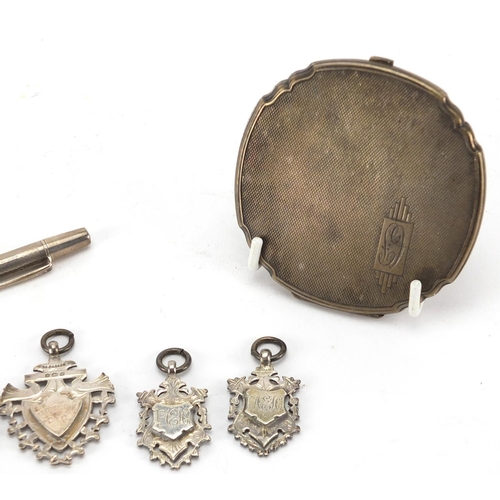 2383 - Silver objects comprising circular compact, Yard-O-Led propelling pencil and four sports jewels, app... 