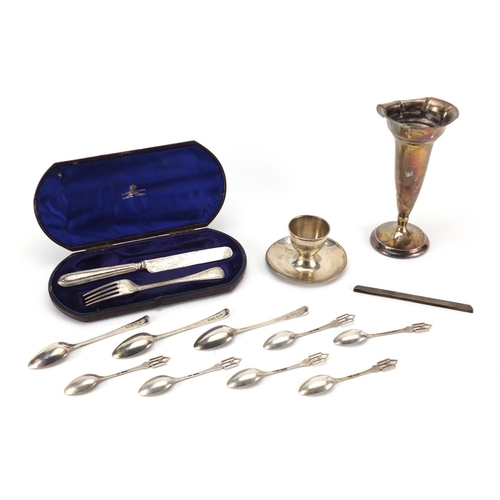 2395 - Victorian and later silver items including a bud vase, egg cup and teaspoons, the largest 17cm high,... 