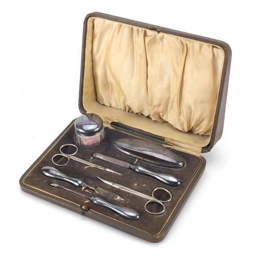 2396 - Silver and stainless steel seven piece vanity set, Birmingham hallmarked, housed in a velvet and sil... 