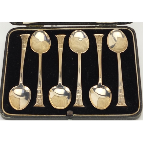 2413 - Two sets of six silver teaspoons, Birmingham and London hallmarks 1928 and 1933, with fitted leather... 