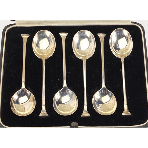 2413 - Two sets of six silver teaspoons, Birmingham and London hallmarks 1928 and 1933, with fitted leather... 