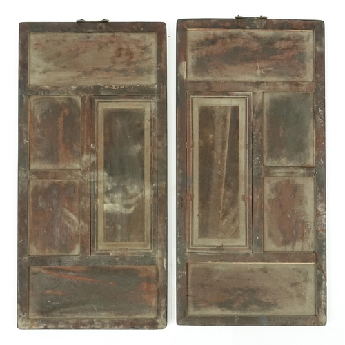 2061 - Pair of Chinese porcelain panes housed in carved hardwood frames, each hand painted in the famille r... 