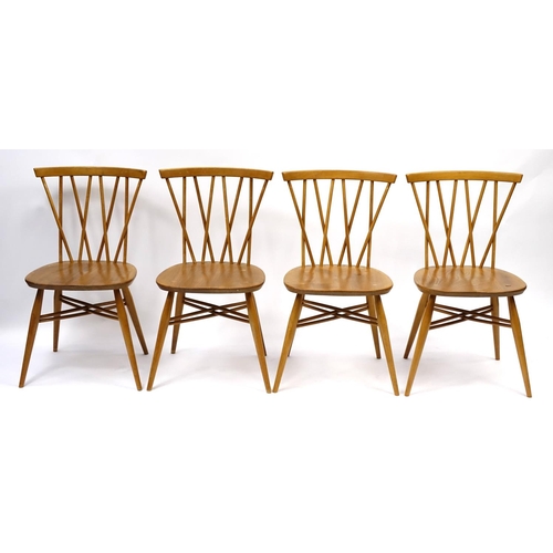 2005 - Ercol light elm drop leaf dining table and four candlestick dining chairs, each chair 80cm high