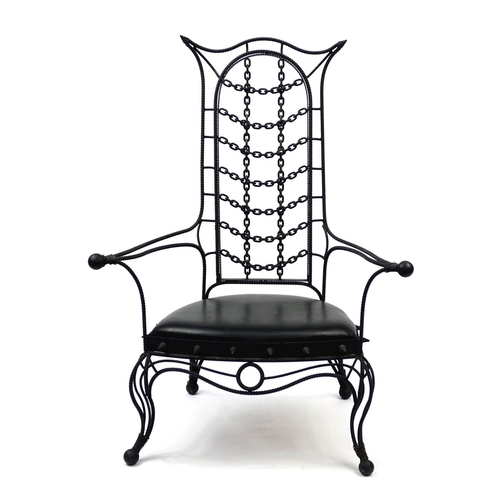 2053 - Gothic style cast iron open arm chair with faux leather seat, 133cm high