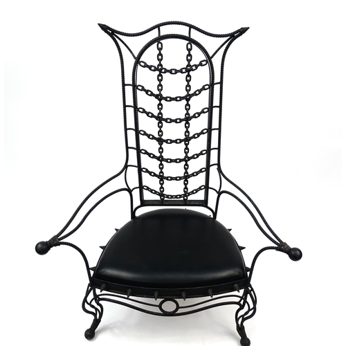 2053 - Gothic style cast iron open arm chair with faux leather seat, 133cm high