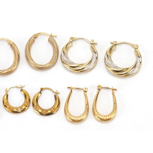 2450 - Six pairs of 9ct gold hoop earrings, the largest 2cm in length, approximate weight 6.4g