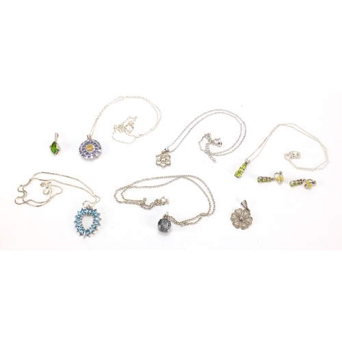 2650 - Silver jewellery set with semi precious stones, with certificates including blue topaz, American per... 