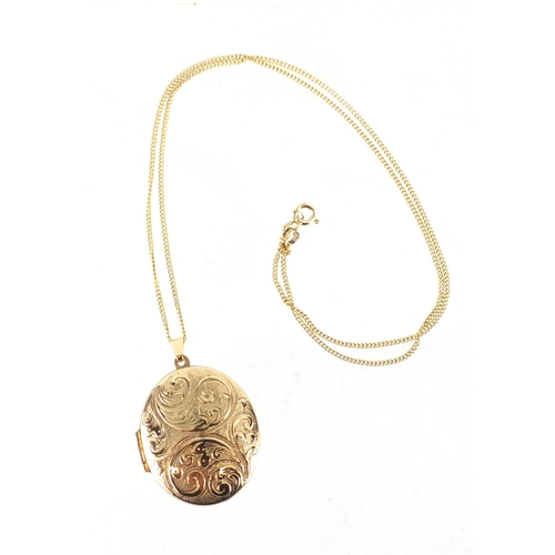 2431 - Oval 9ct gold locket with floral chased decoration, on a 9ct gold necklace, the locket 4.5cm in leng... 