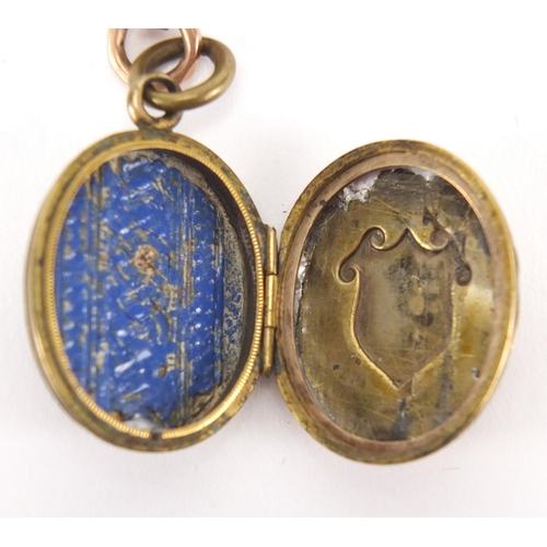 2428 - Victorian 9ct gold watch chain with T-bar and a gilt metal enamelled locket, 37cm in length, approxi... 