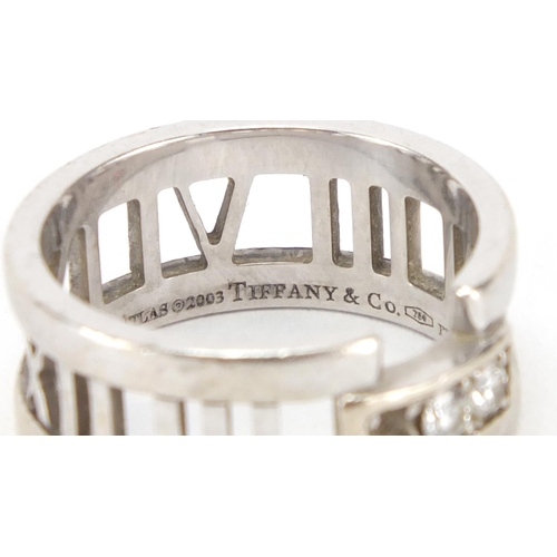 2455 - Tiffany & Co 18ct white gold diamond ring, with Roman numeral band, size M, approximate weight 7.1g