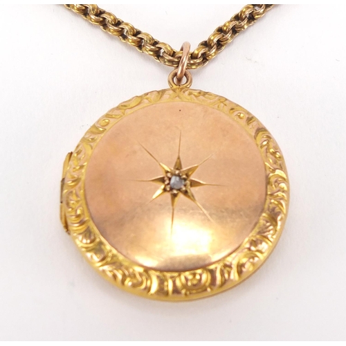 2466 - Victorian 9ct gold locket set with a central diamond, on a 9ct gold necklace, the locket 2.8cm in di... 
