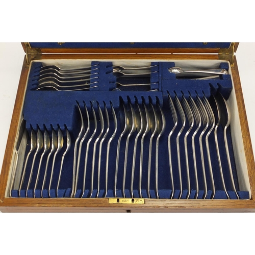 2124 - Elkington & Co oak six place canteen of silver plated and stainless steel cutlery, 38cm wide