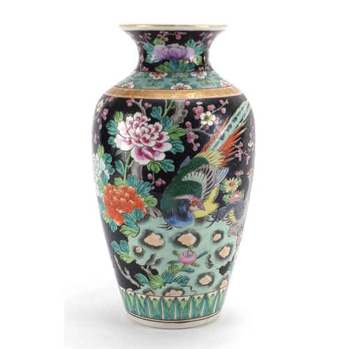 2119 - Chinese porcelain famille noire vase hand painted with birds of paradise amongst flowers, 30cm high