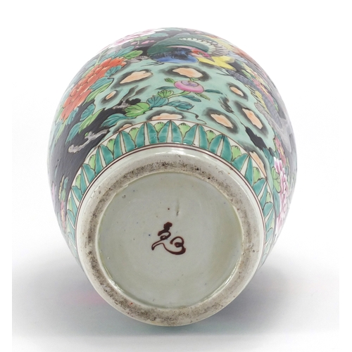 2119 - Chinese porcelain famille noire vase hand painted with birds of paradise amongst flowers, 30cm high
