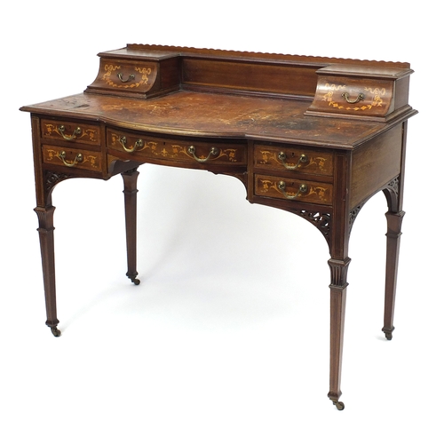2011 - Victorian inlaid mahogany writing desk with tooled leather insert and an arrangement of seven drawer... 