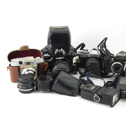 206 - Vintage and later cameras lenses and accessories including Halina, Kodak, Olympus and Minolta