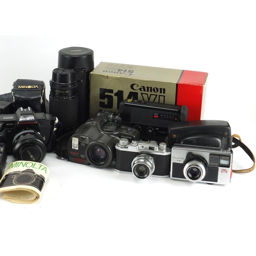 206 - Vintage and later cameras lenses and accessories including Halina, Kodak, Olympus and Minolta