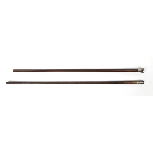 286 - Two walking sticks with silver pommels, the largest 88cm in length