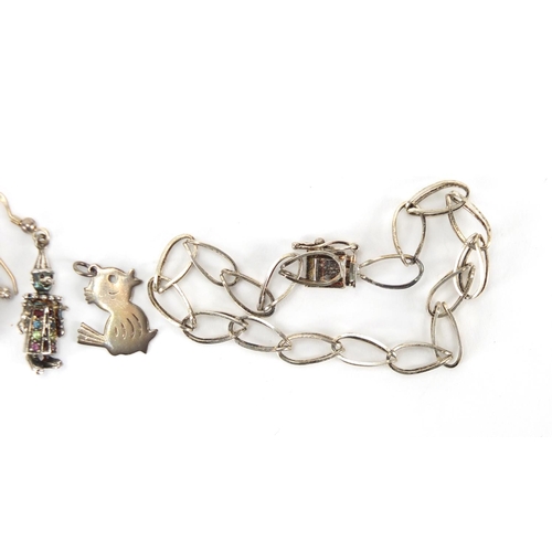 225 - Silver jewellery comprising bracelet, pair of clown earrings, teddy bear, duck pendant and a leaf br... 